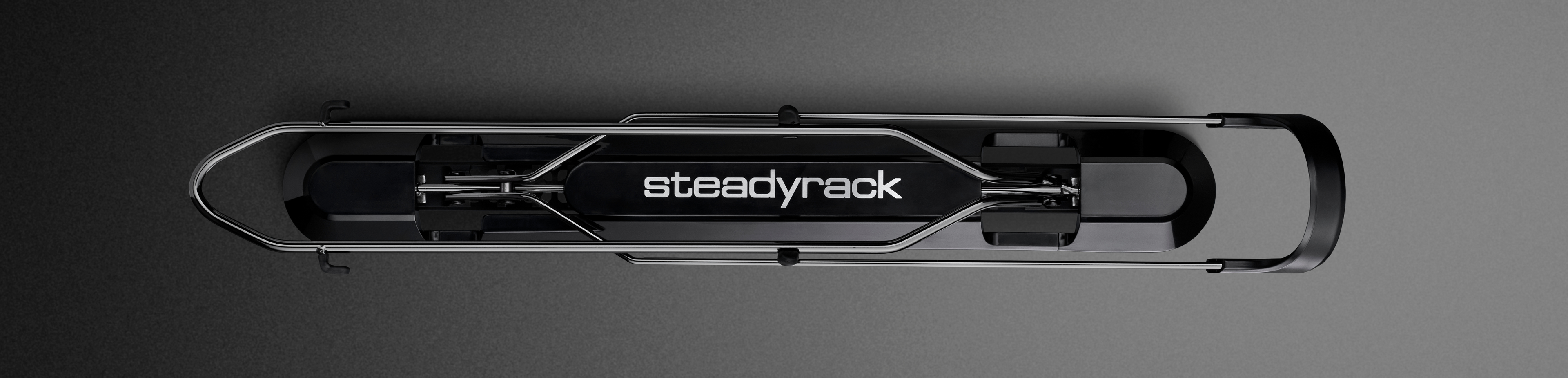 Black Steadyrack bike rack on a grey background